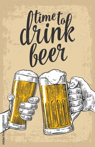 Two hands holding and clinking with two beer glasses mug