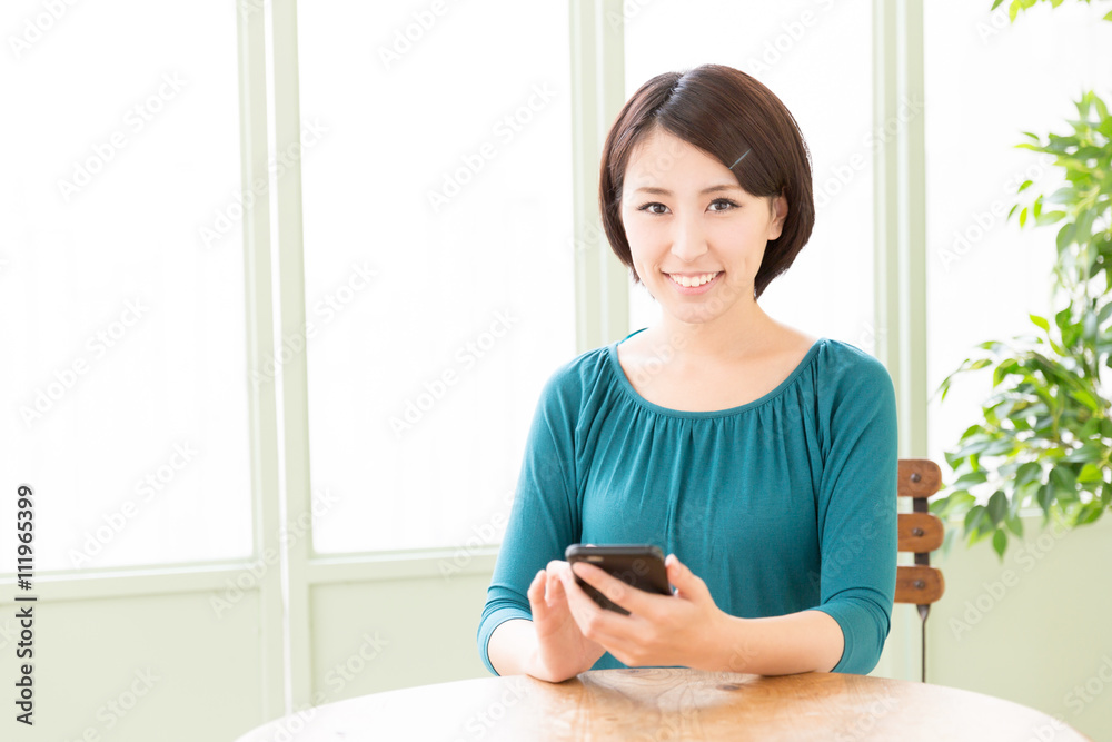 young asian woman using smart phone in the cafe young asian woman using smart phone in the cafe