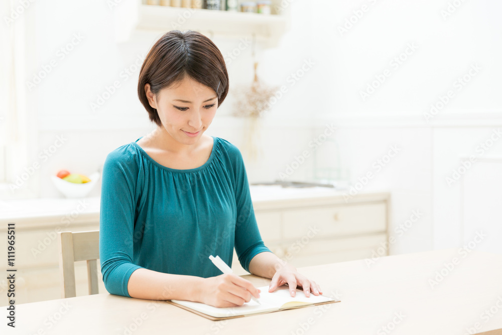 young asian woman in the kitchen young asian woman in the kitchen