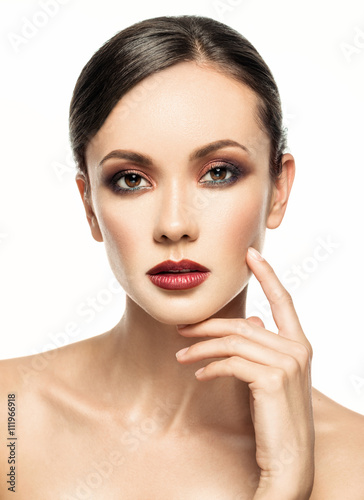 Portrait of beautiful young brunette girl with clean face.