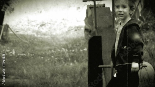 Young boy playing with his father - retro, 1950's old camera footage	