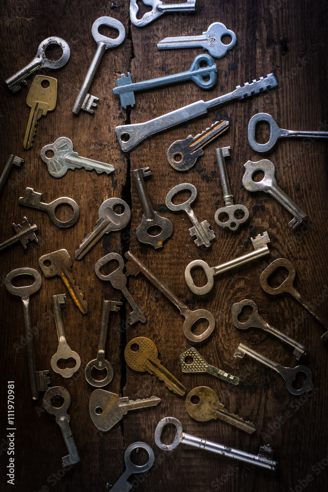 Set of keys on wood background Set of keys on wood background