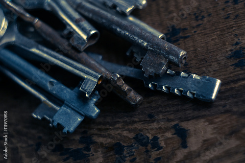 Set of keys on wood background