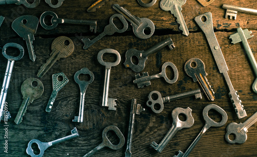 Set of keys on wood background