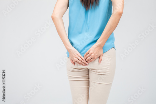 Woman has Diarrhea Holding her Butt: Isolated on White Backgroun
