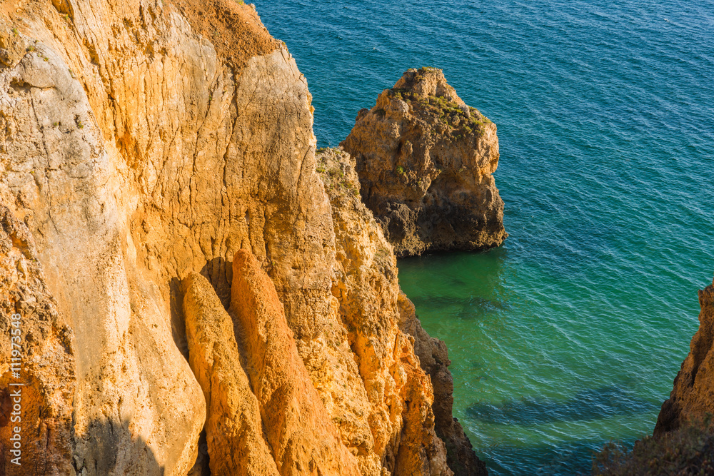 Beautiful bay with rocks and turquoise water at the coast of Portimao. Algarve region. Portugal