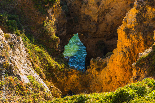 Sea caves on the coast of Portimao. Algarve region. Portugal