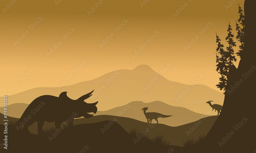 Parasaurolophus and Triceratops in hills of silhouette