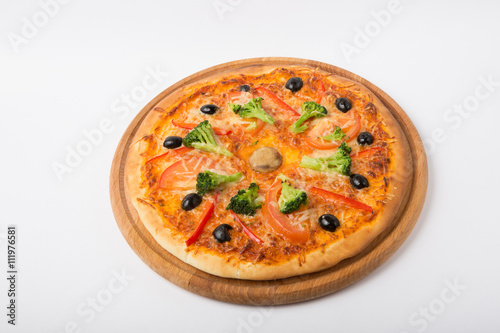 Whole pizza on white background