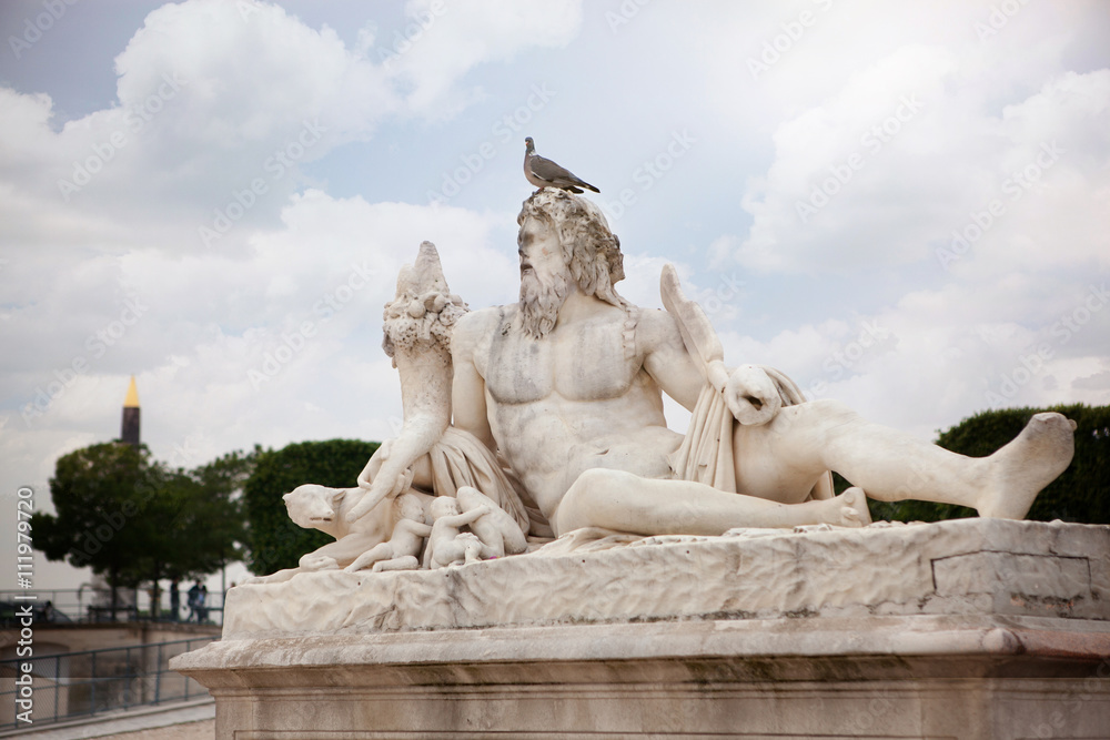 The statue Le Tibre in Tuileries Garden in Paris.