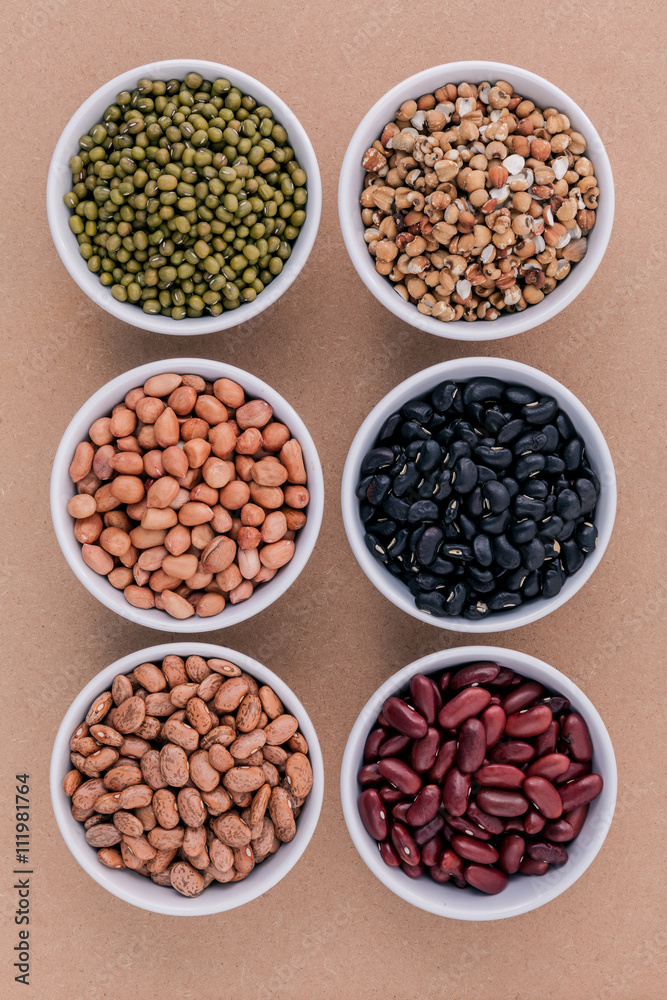 Assortment of beans and lentils in wooden spoon isolate on white Assortment of beans and lentils in wooden spoon isolate on white