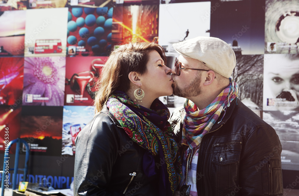 Young couple kissing, London, United Kingdom Young couple kissing, London, United Kingdom