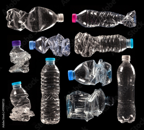 variety of compressed plastic bottles isolated on black background