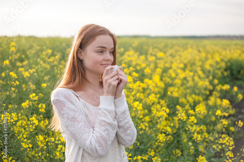 Pollen allergy, girl sneezing in a field of flowers