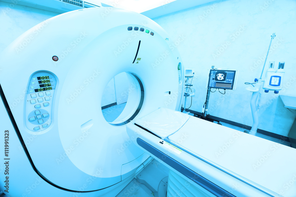 CT scanner room in hospital take with art lighting and blue filter CT scanner room in hospital take with art lighting and blue filter