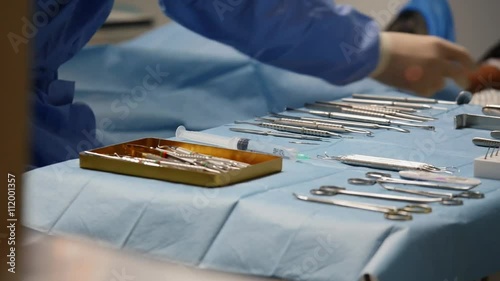Wallpaper Mural surgical instruments on the table, the doctor takes tools Torontodigital.ca