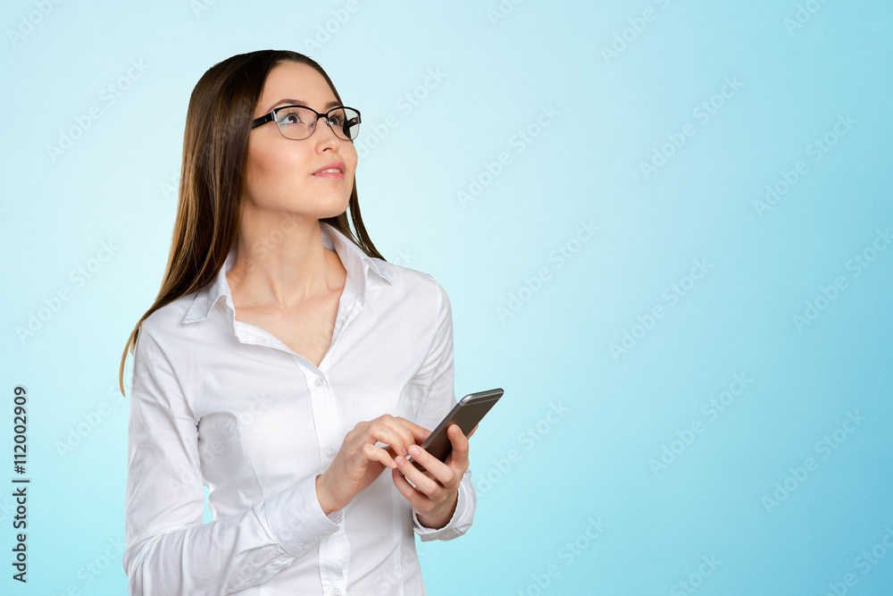 Young, confident, successful and beautiful business woman with the mobile phone isolated Young, confident, successful and beautiful business woman with the mobile phone isolated