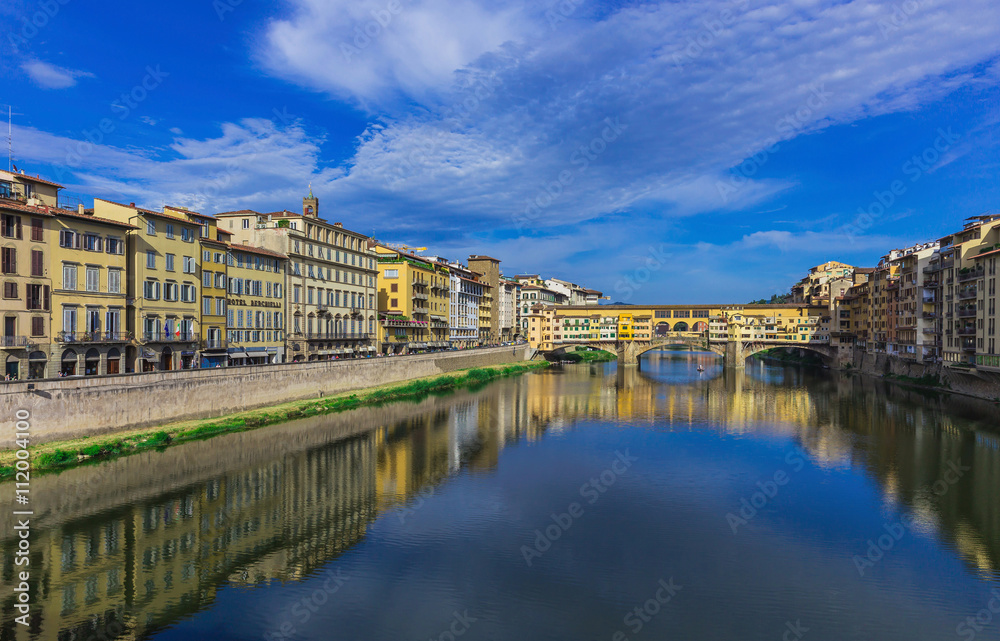 Ponte Vecchio, old bridge, medieval landmark on Arno river and its reflection. Florence, Tuscany, Italy.