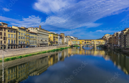 Ponte Vecchio, old bridge, medieval landmark on Arno river and its reflection. Florence, Tuscany, Italy.