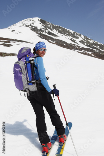 Woman skiing, Storulvan, Jamtland, Sweden photo