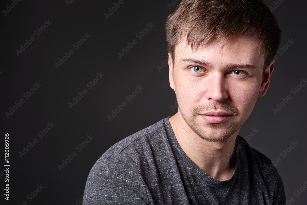 Obraz premium Portrait of casual young man with light beard, horizontal format