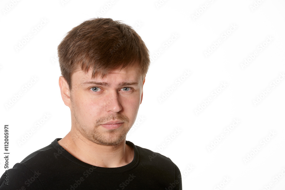 Fototapeta premium Portrait of serious young man, questioning expression,horizontal
