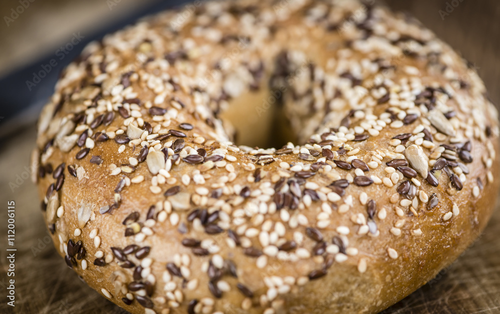 Wooden table with fresh baked wholemeal Bagels Wooden table with fresh baked wholemeal Bagels