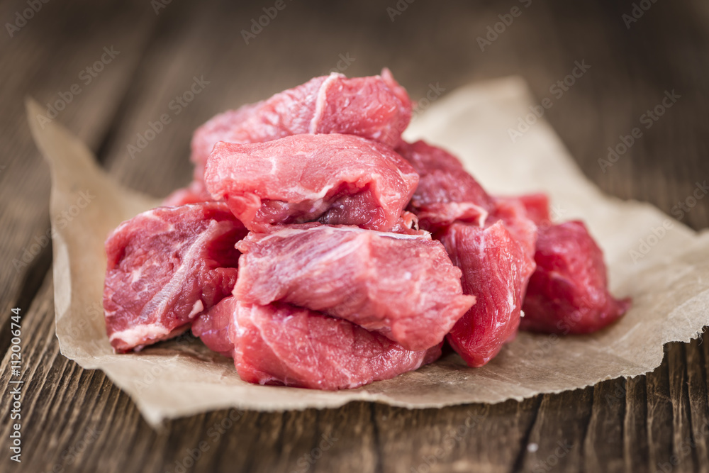 Beef Fillet (chopped) on wooden background Beef Fillet (chopped) on wooden background