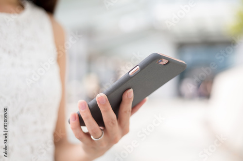 Woman sending message on phone