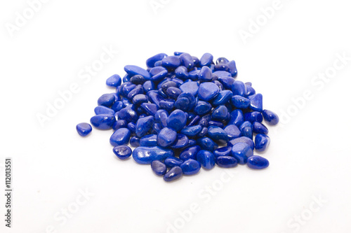 Decorative blue stones on white background