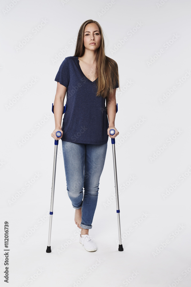 Confident woman sitting on stool, portrait Confident woman sitting on stool, portrait