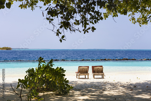 beach chairs on the tropical sand beach © czamfir