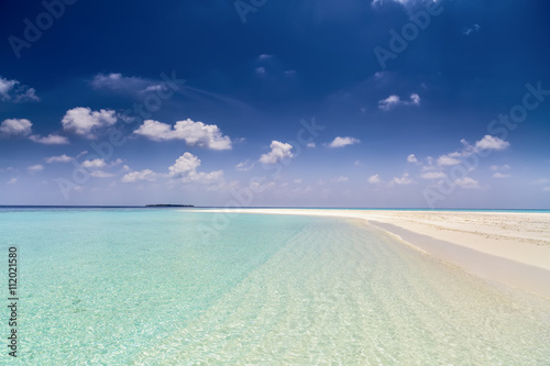 tropical beach with crystal clear water and white sand