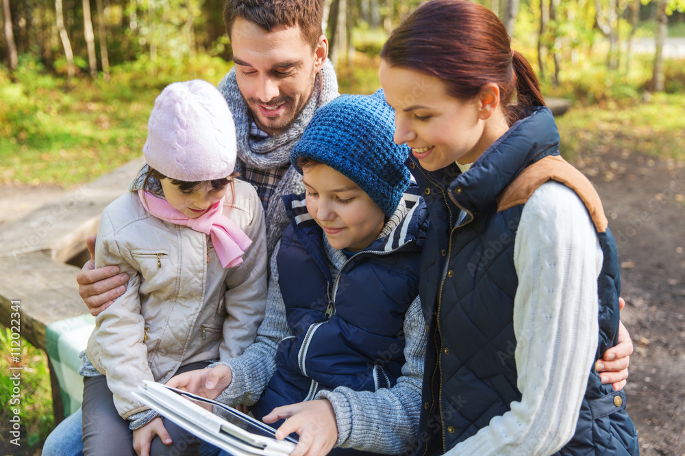 happy family with tablet pc at camp happy family with tablet pc at camp