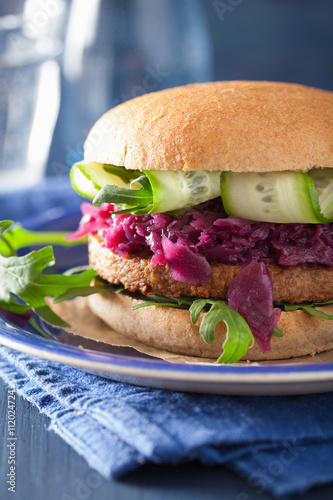 veggie soy burger with pickled red cabbage cucumber arugula