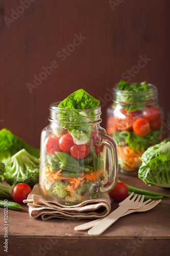 healthy vegetable salad in mason jar. tomato, broccoli, carrot,