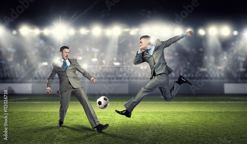 Two businessmen fight for ball © Sergey Nivens