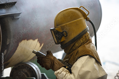 Surface preparation by sand blasting photo
