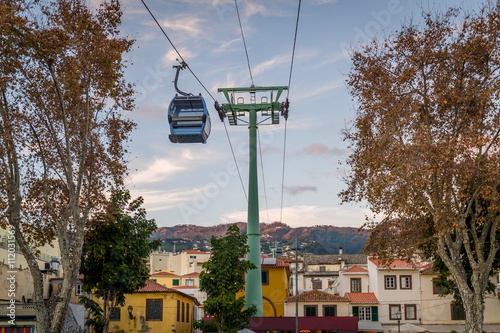 Cable car is going over the old town of Funchal. Madeira island.