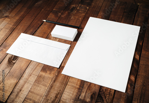Blank branding ID template on vintage wooden table background. Mock-up for design portfolios.
