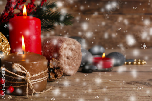 Christmas spa on wooden background with snow effect