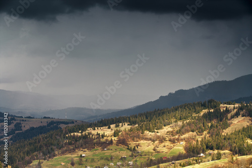 Spring rain in mountains. Thunder and clouds