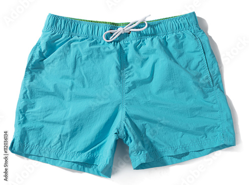 Blue swim trunks isolated on white background.