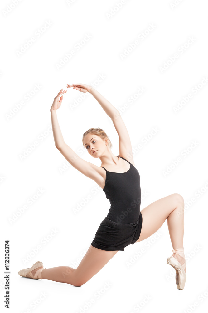 Woman in ballet shoes with arms raised looking away Woman in ballet shoes with arms raised looking away