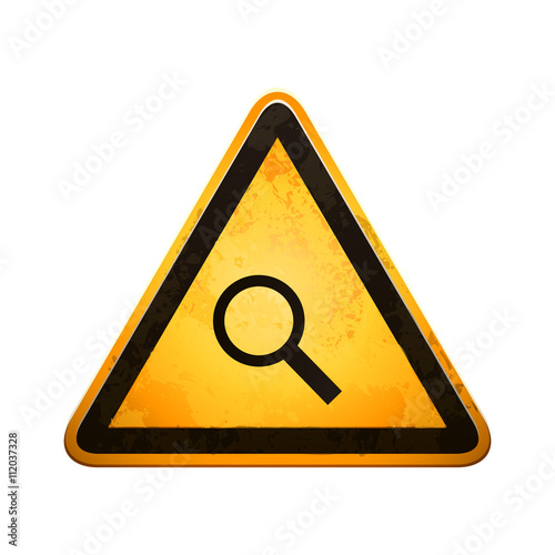 danger sign with a magnifying glass