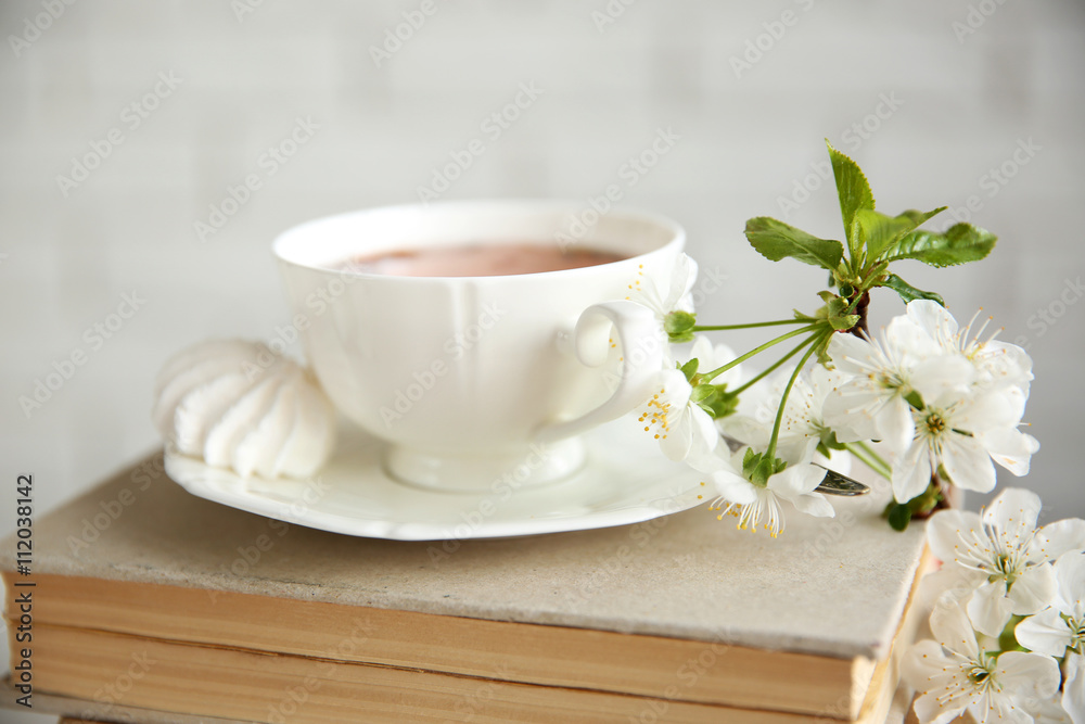 Cup of tea and books, close up