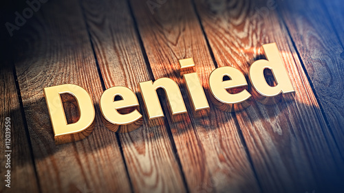 Word Denied on wood planks photo