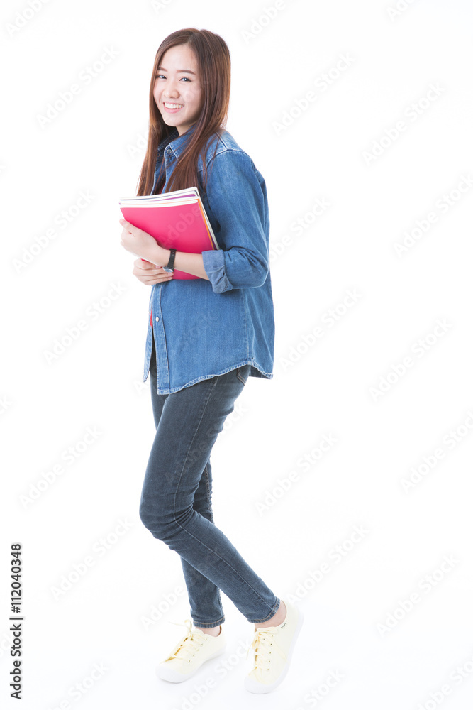 Young asian student girl with book. Isolated on white background Young asian student girl with book. Isolated on white background