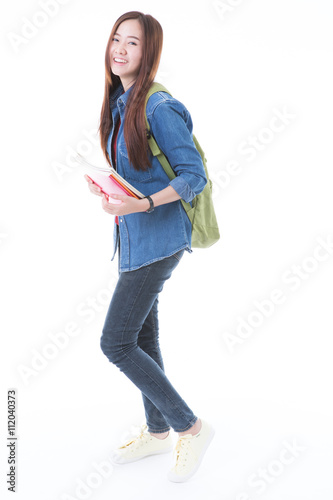 Young asian student girl with book. Isolated on white background