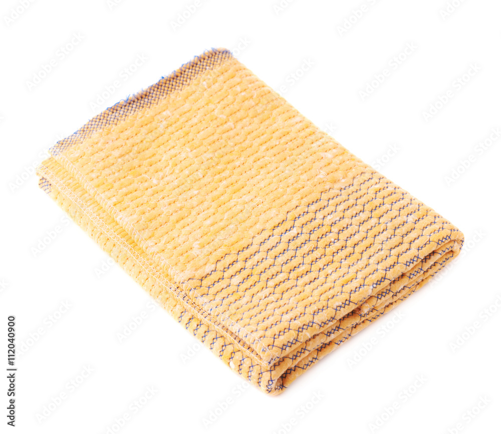 Folded yellow towel isolated over the white background Folded yellow towel isolated over the white background